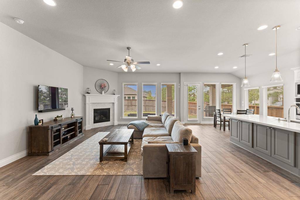 The family room enjoys an inviting fireplace.
