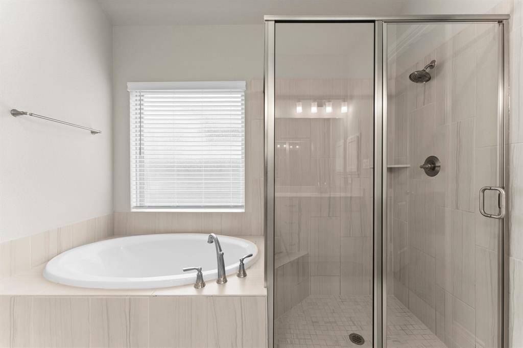Nice size shower and soaking tub.