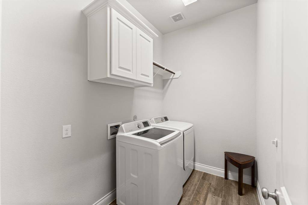 Utility with room for an extra refrigerator.