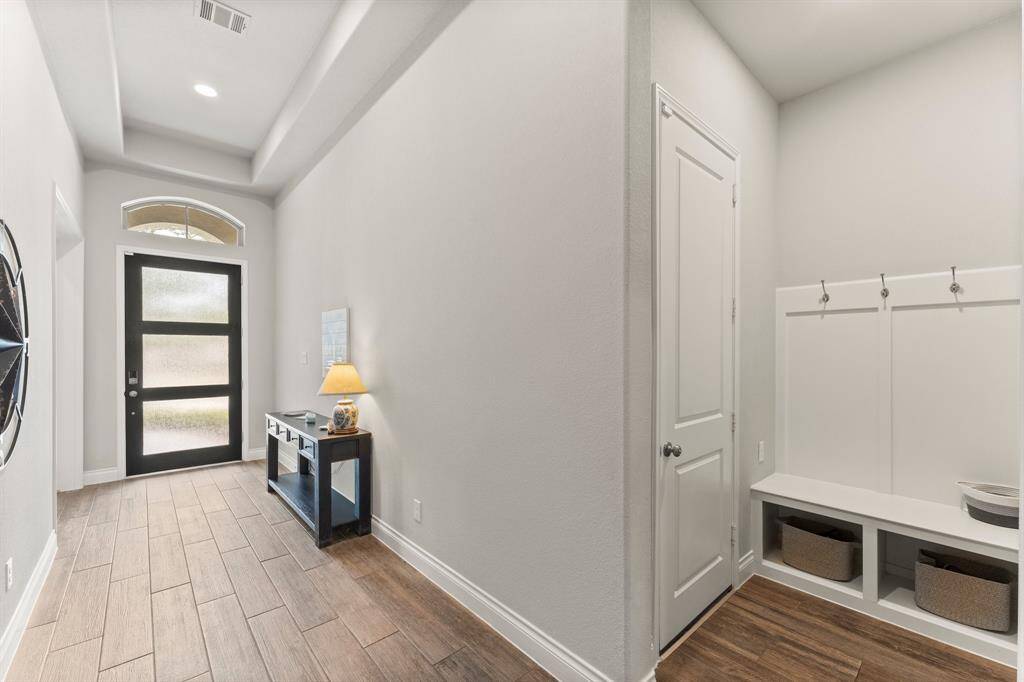Convenient drop zone off garage entry.