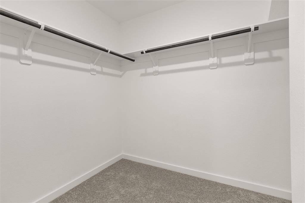 As you glide through the spacious layout, you'll appreciate the thoughtful design elements that make getting ready a joy.