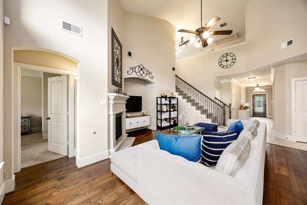 Modern living room with clean lines, abundant light, and seamless flow into the rest of the home. *Virtually Staged