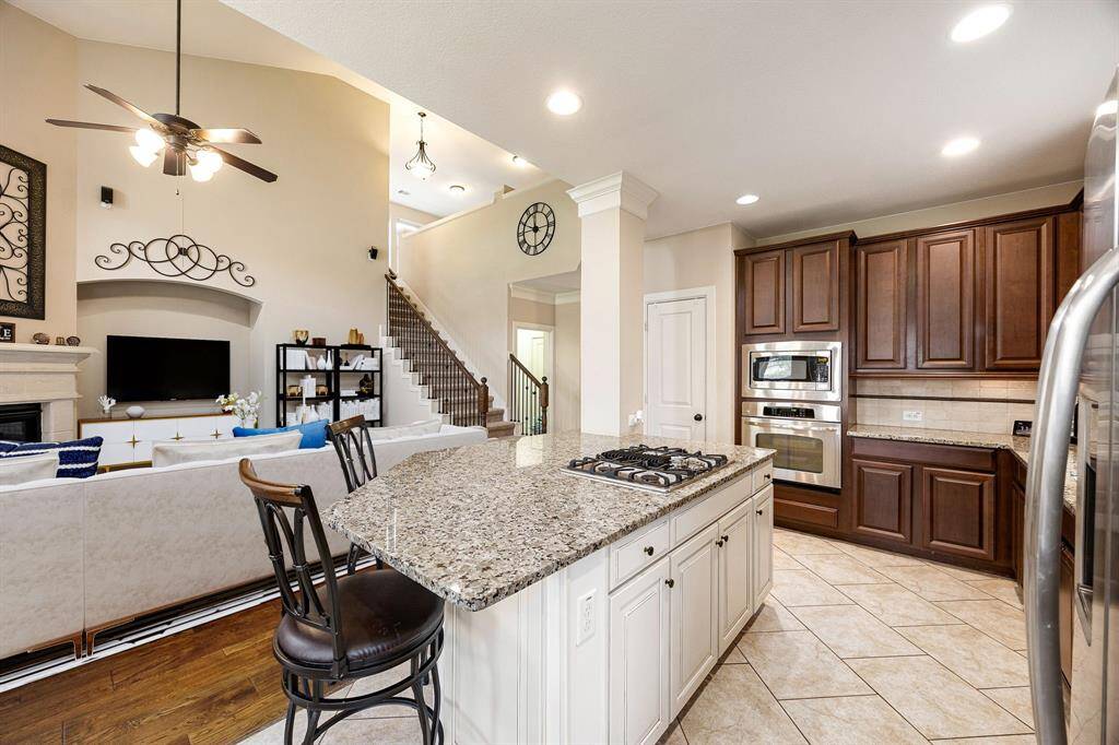 Any chef's dream, this stunning kitchen is perfect for everyday life as well as entertaining family and friends! Extra large kitchen island is perfect for conversation or that much needed space to lay out your party spread for everyone to enjoy! Large windows provide lovely views of your backyard and plenty of natural lighting throughout the day. *Virtually Staged