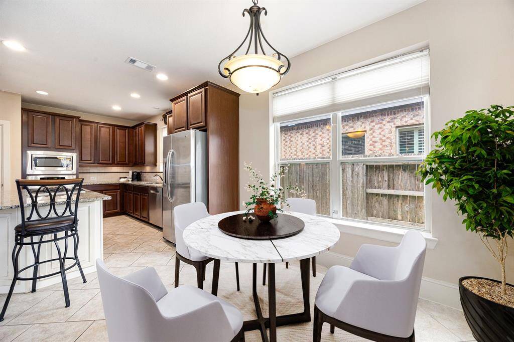 Start your day off right with a cup of coffee sitting with your family in the lovely breakfast area! Featuring large windows with blinds, custom neutral paint, tile flooring, recessed lighting and high ceilings. *Virtually Staged