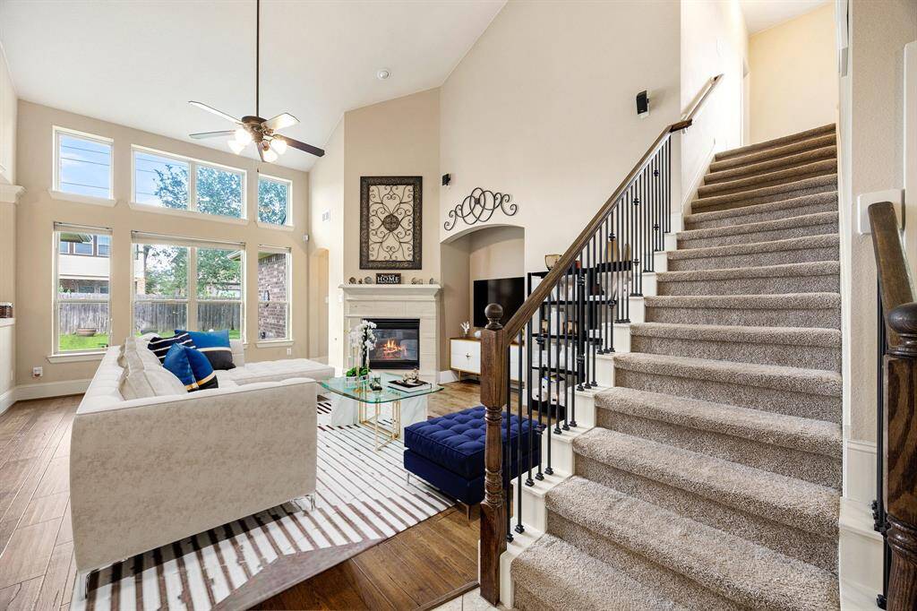 Bright and welcoming living room with large windows, neutral tones, and an open layout perfect for relaxing or entertaining. *Virtually Staged
