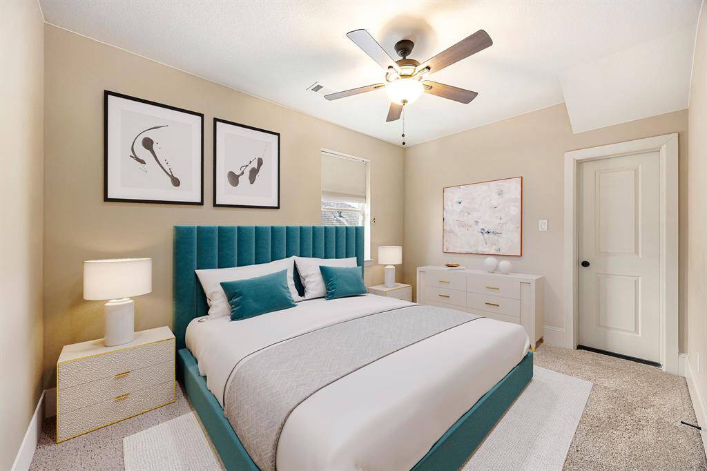 Secondary bedroom great for use as an in-law suite or guest suite features high ceilings, lovely modern ceiling fan, custom paint, plush carpet, space for seating area, direct access to the secondary bathroom and large window with privacy blinds. *Virtually Staged