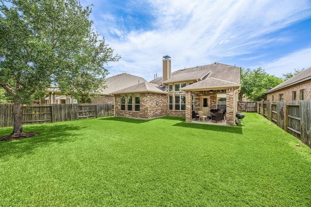 Charming front exterior with great curb appeal, mature landscaping, and a welcoming entrance that invites you home.