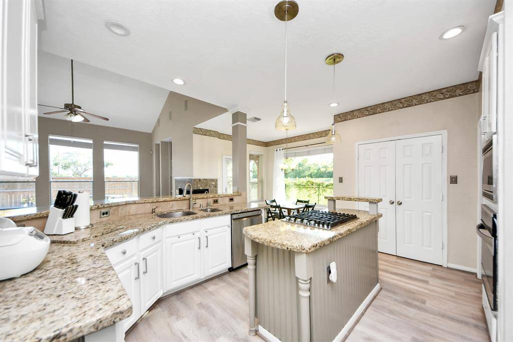 Kitchen with dinning space and Backyard view