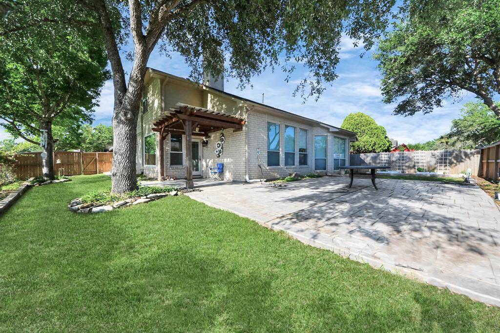 Perfect combination of back yard area with  grass, concrete and area for gardening