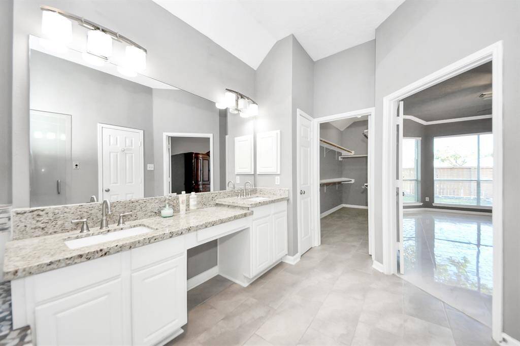Master Bathroom with 2 sinks and long closet space