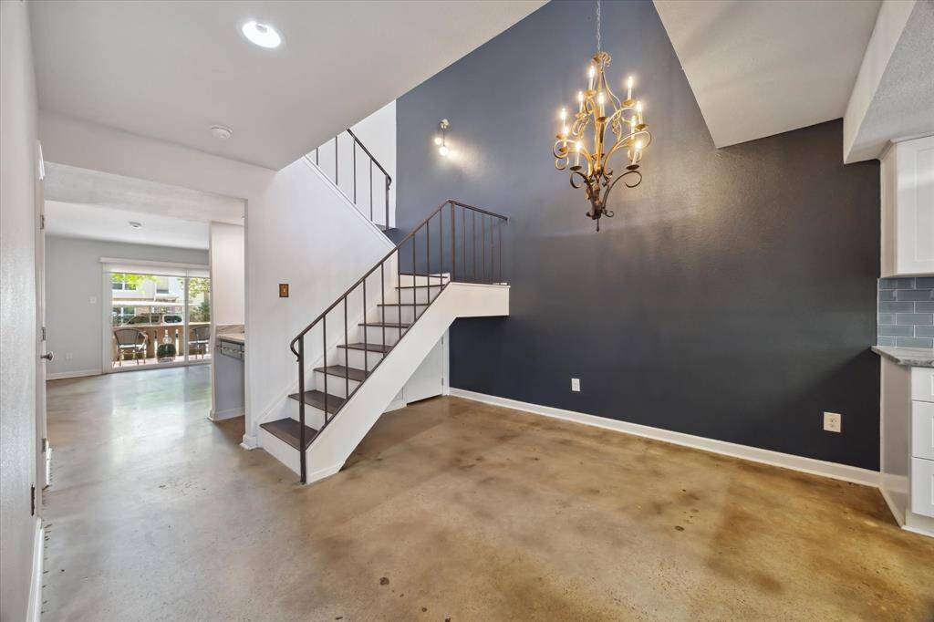 Upon entry you are met with your new dining room and a modern staircase leading to the upper floor.