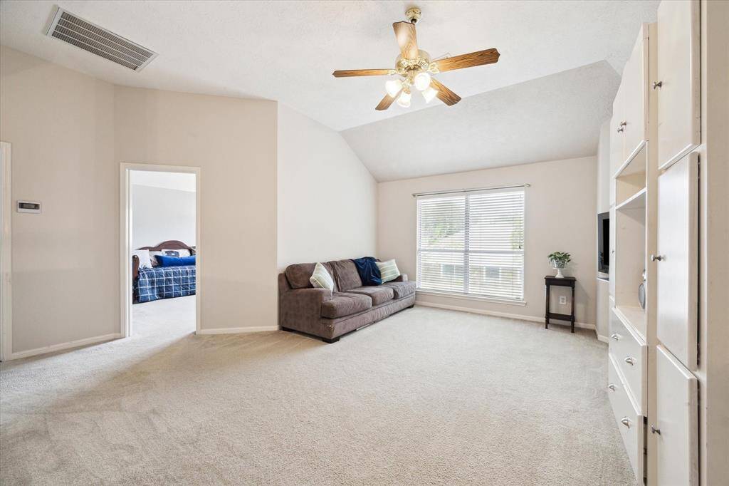 Game room with built in cabinetry.