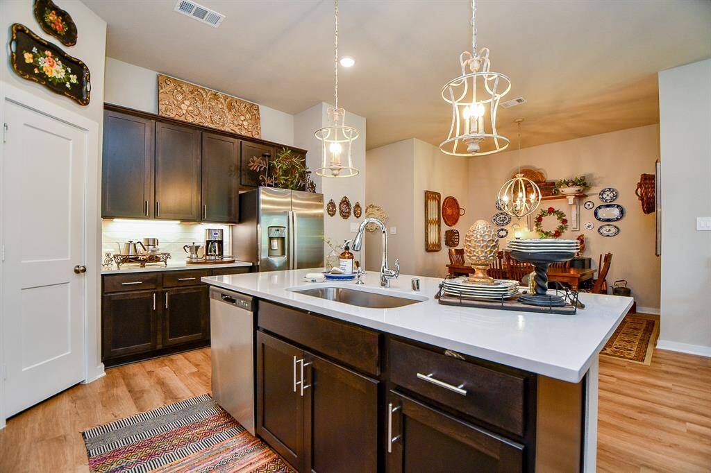 VIEW OF KITCHEN SHOWING THE DINING AREA ACROSS FROM KITCHEN