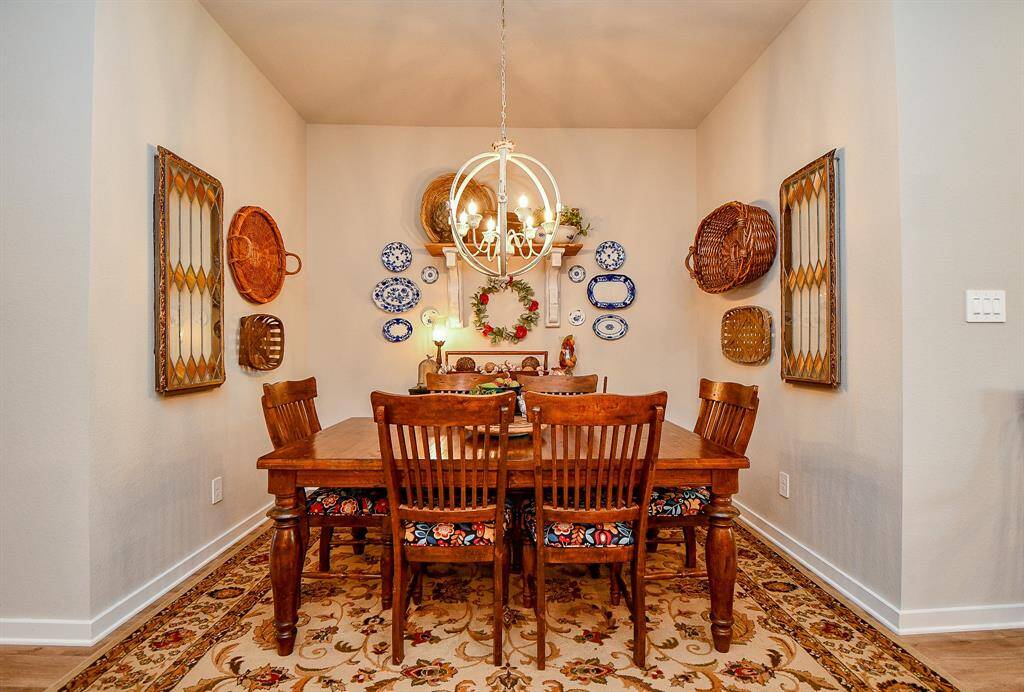 BEAUTIFUL BREAKFAST/DINING AREA WITH NEW LIGHT FIXTURE