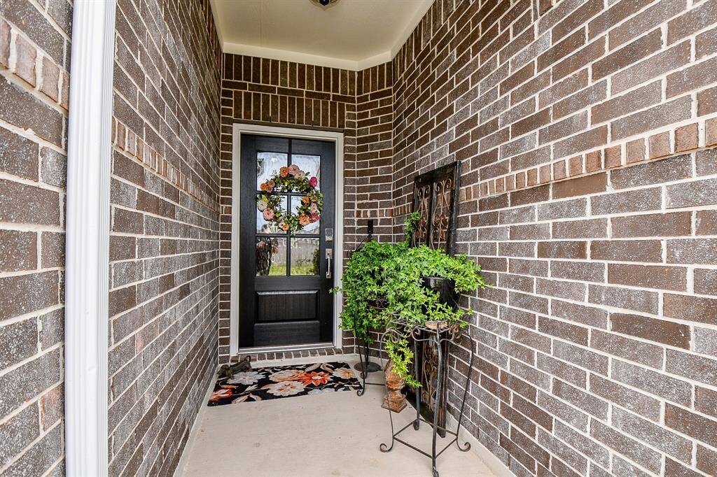 ENTRY WITH GLASS PANED FRONT DOOR ADDS CHARM AS YOU ENTER THIS HOME