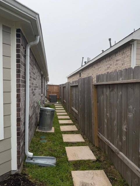 LEFT SIDE OF HOME ALSO HAS PAVERS FOR EASY ACCESS TO TRASH CAN AREA AND EASY ACCESS TO AC UNIT