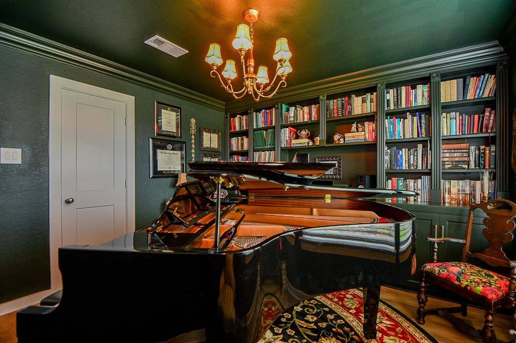 THE COLOR DRENCH IN THIS ROOM IS STUNNING! ADDED MOULDINGS FOR A CUSTOM LOOK. THIS ROOM IS BEING USED AS A MUSIC ROOM BUT CAN BE HOME OFFICE OR BEDROOM 4