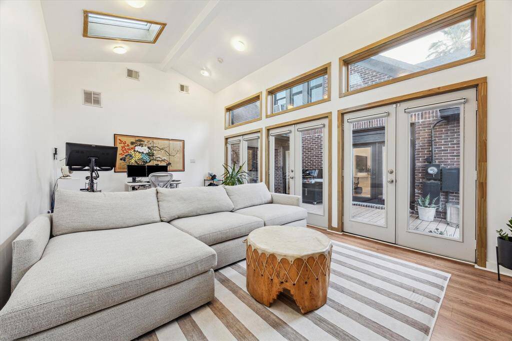Alternate view of studio - Lined with french doors to back patio. A great bonus space being currently utilized as a family room.