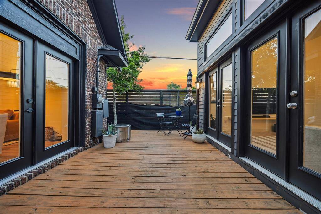 Alternate view of back patio deck with wrap around yard to front turfed yard.