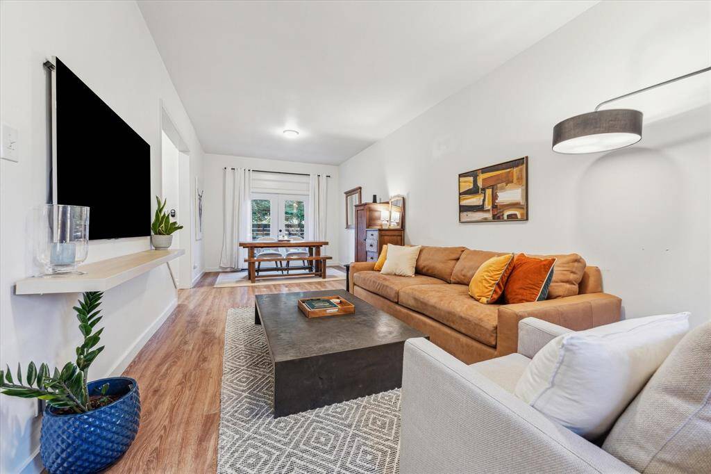 Alternate view. Currently situated with dining with via french doors leading to front lawn. A transitional living can allow for additional seating.