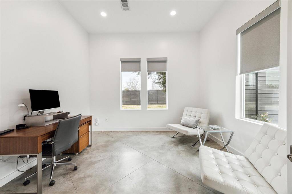 Bright and sophisticated office with abundant natural light, sleek design, and a perfect ambiance for productivity.