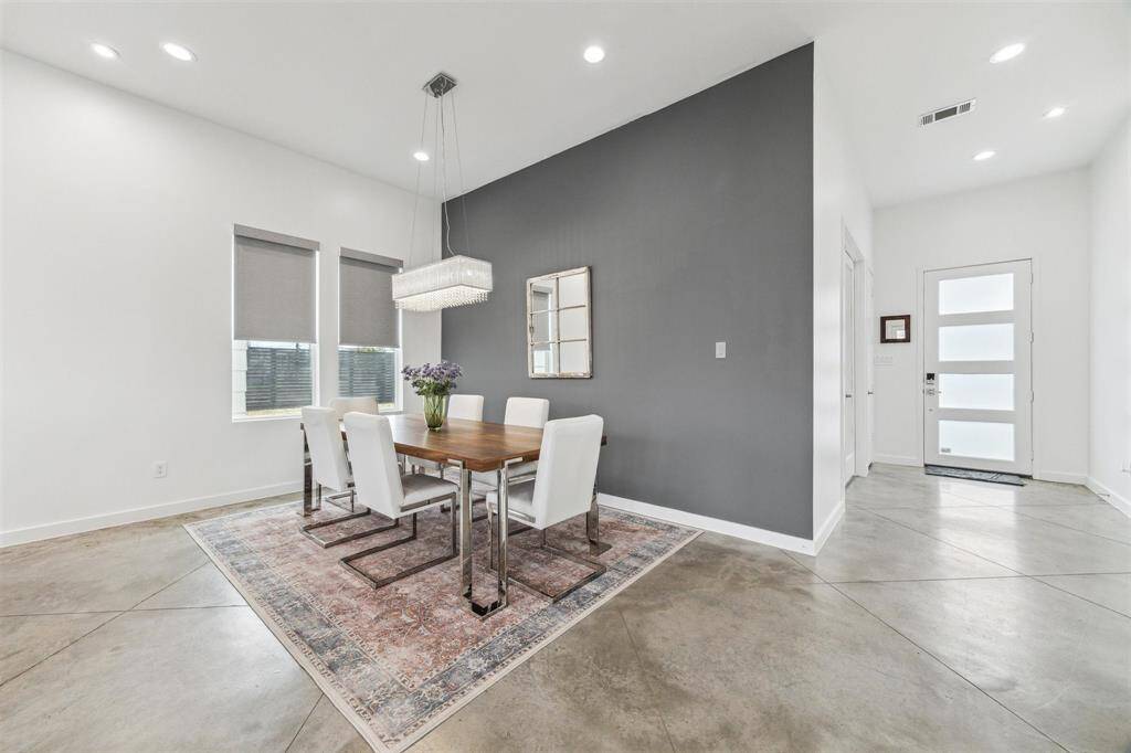 Elegant dining area with chic lighting, stylish décor, and a warm ambiance perfect for gatherings.