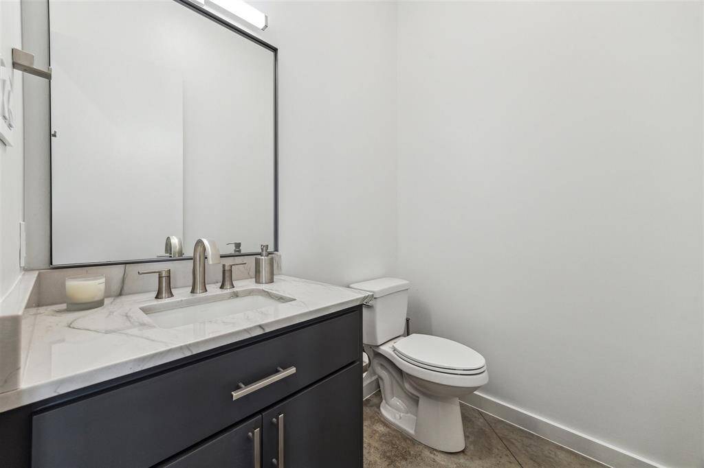 Stylish half bath with a sleek new counter, modern sink, and updated lighting for a fresh, inviting look.