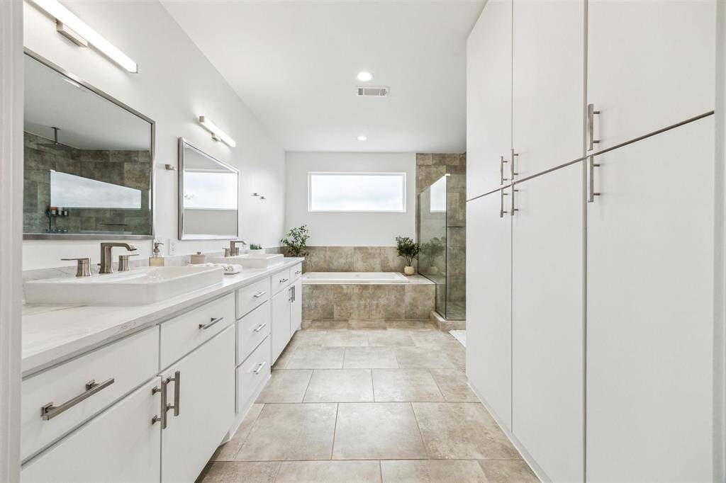 Charming bath with a sleek new countertop and modern sinks, offering a fresh, polished look.
