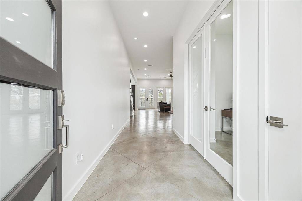 Inviting entrance with a bold doorway, freshly painted walls, and a seamless blend of charm and modern elegance.