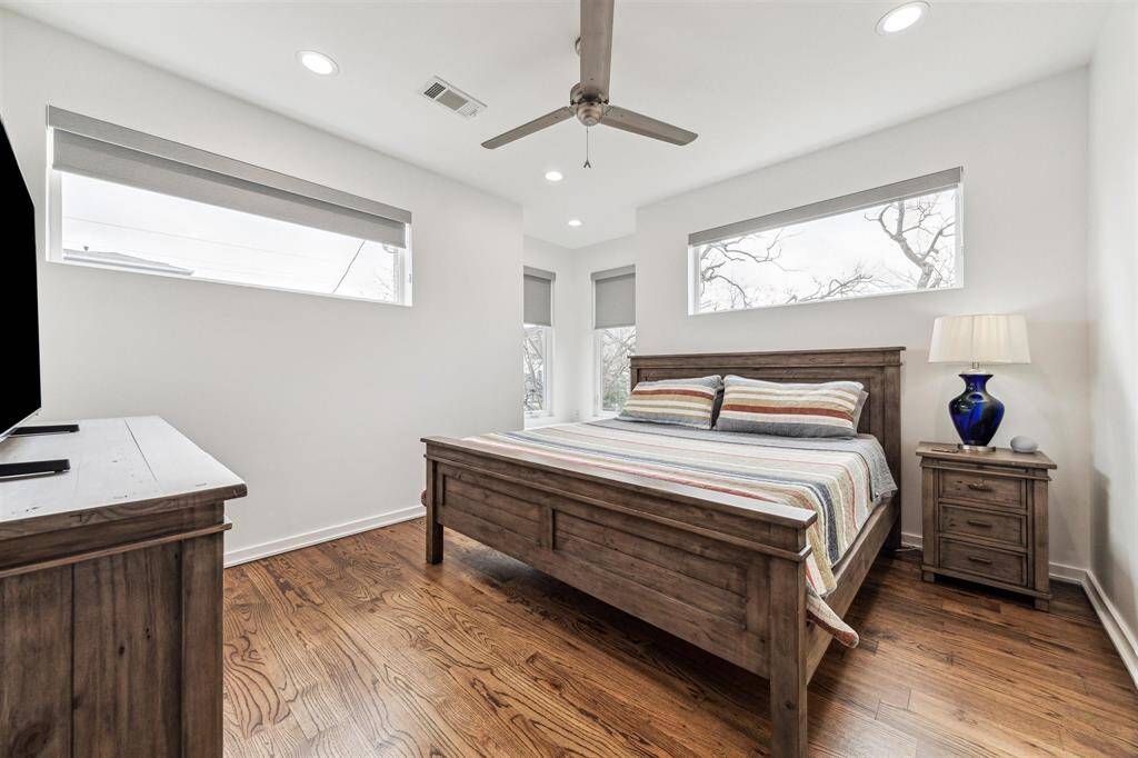 Serene bedroom with new room darkening shades, offering complete tranquility and restful ambiance.