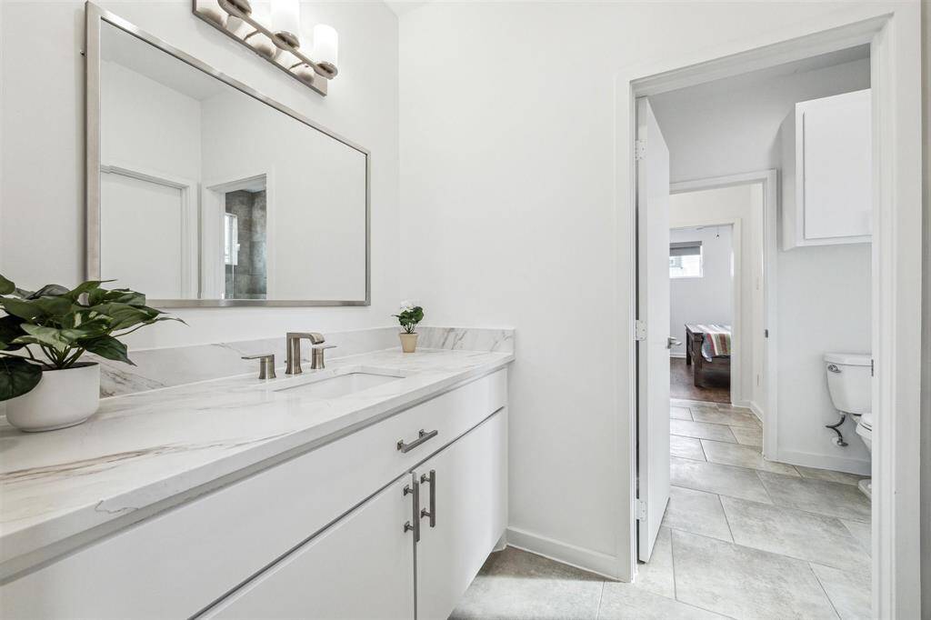 Stylish bath featuring a sleek new counter and contemporary sinks for a fresh, modern vibe.