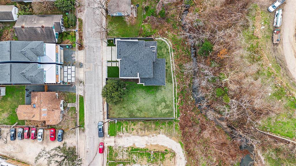 Stunning aerial view showcasing the expansive property, lush landscaping, and impeccable layout.