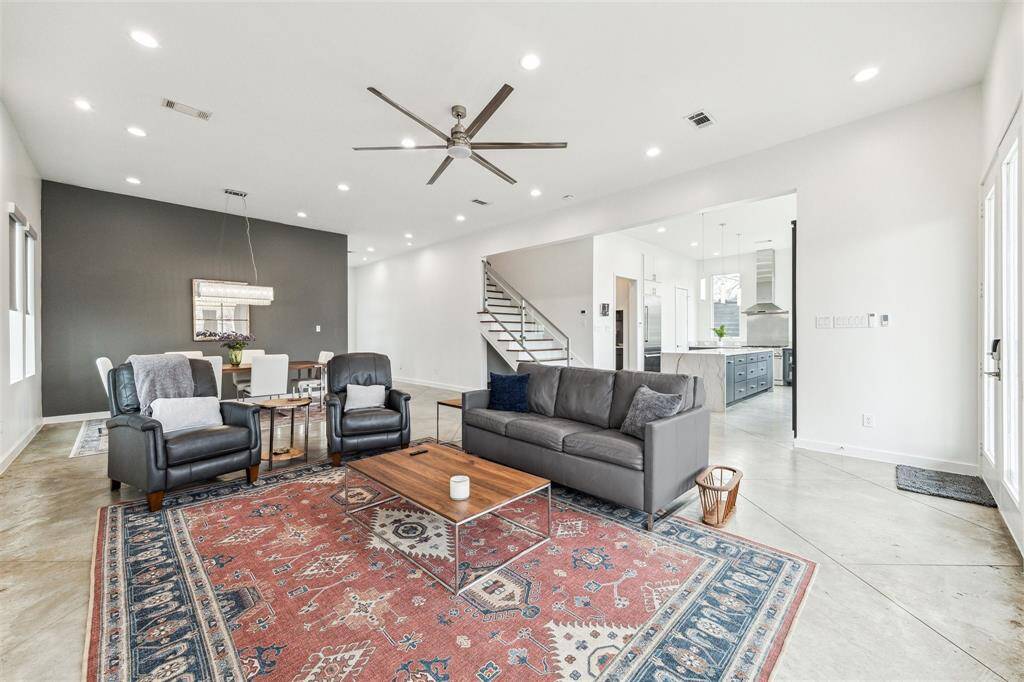 Inviting living area with modern finishes, abundant natural light, and a cozy yet sophisticated atmosphere.