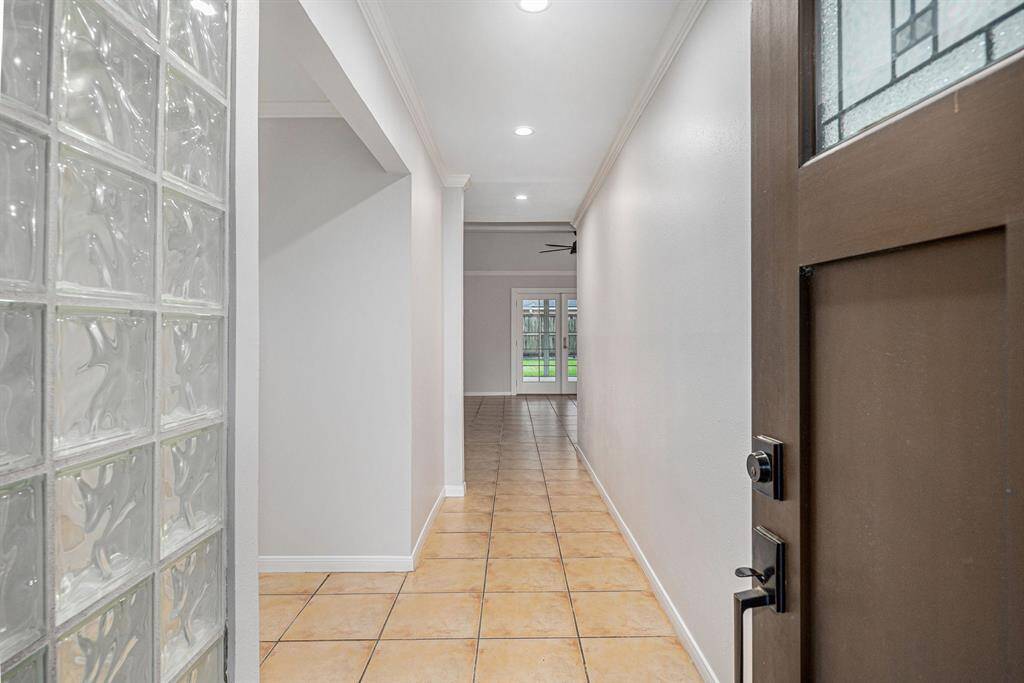 Entry to home. Room on left was probably built as formal living - would also make great office or playroom! Straight ahead to large family room.