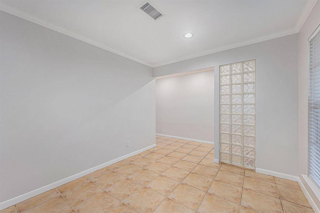 Front room looking out. Block glass half wall gives the room a much more open feel.