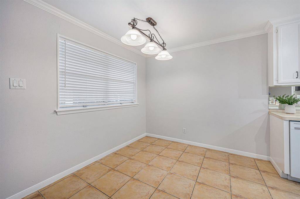 Breakfast room with large window for natural light.