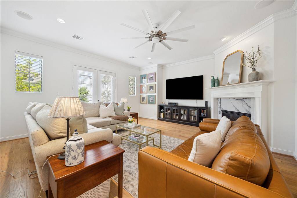 The living room is filled with natural light.  Imagine cozy nights snuggled in by the fire!
