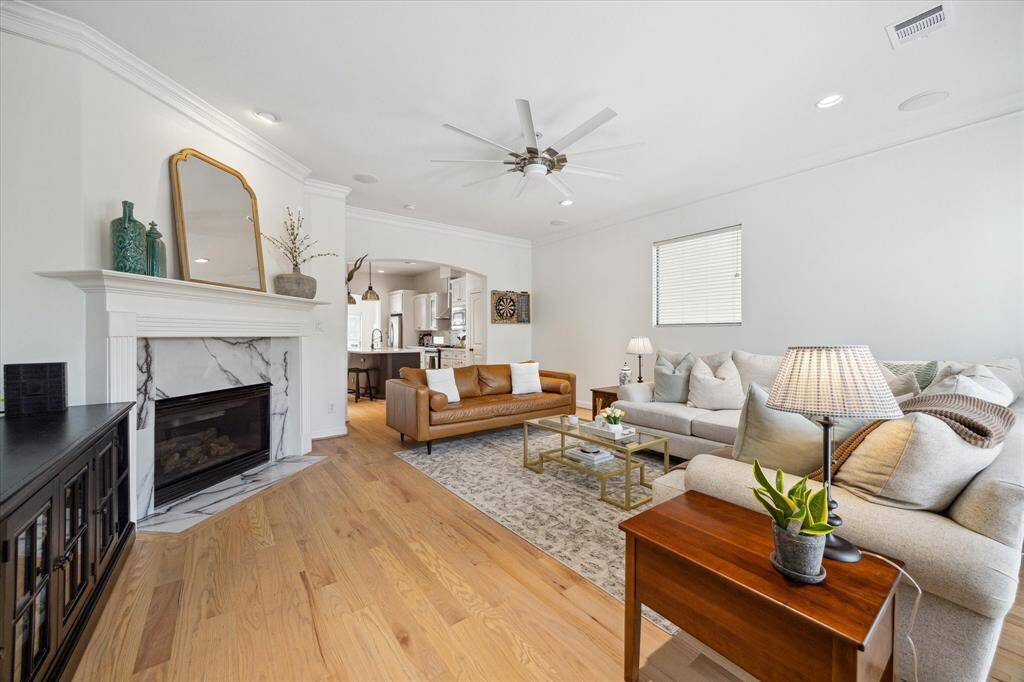 The hardwood floors are a wonderful complement to this light-filled and spacious room.