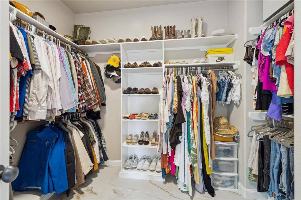 The well designed primary main closet.  A second closet is located in the bedroom.