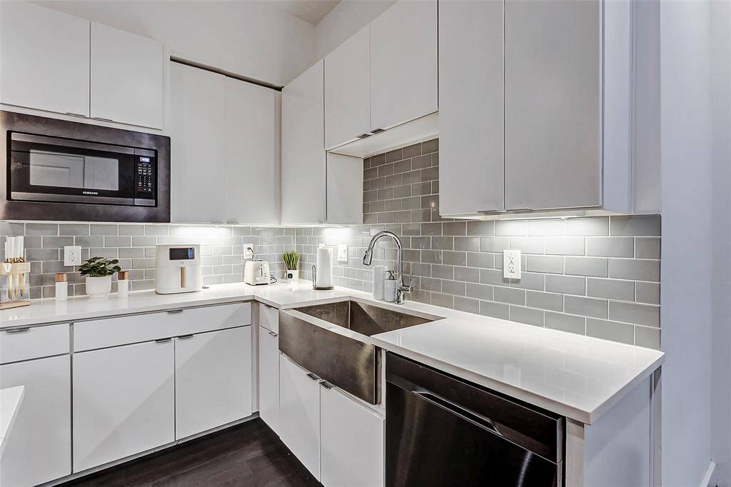 Open space kitchen with stainless steel appliances.