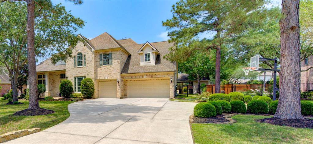 Grand curb appeal welcomes you with an elegant brick façade to 6 Laxey Glen Drive