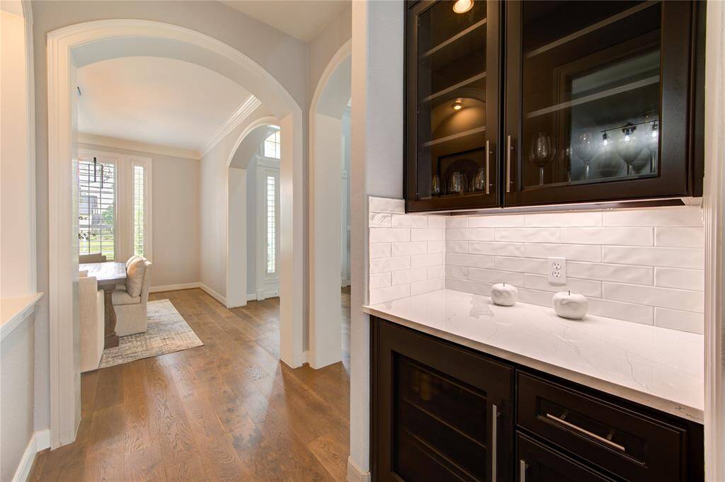 Nestled between the kitchen and dining room, this butler’s pantry includes custom cabinetry and a beverage fridge—ideal for hosting and serving in luxury