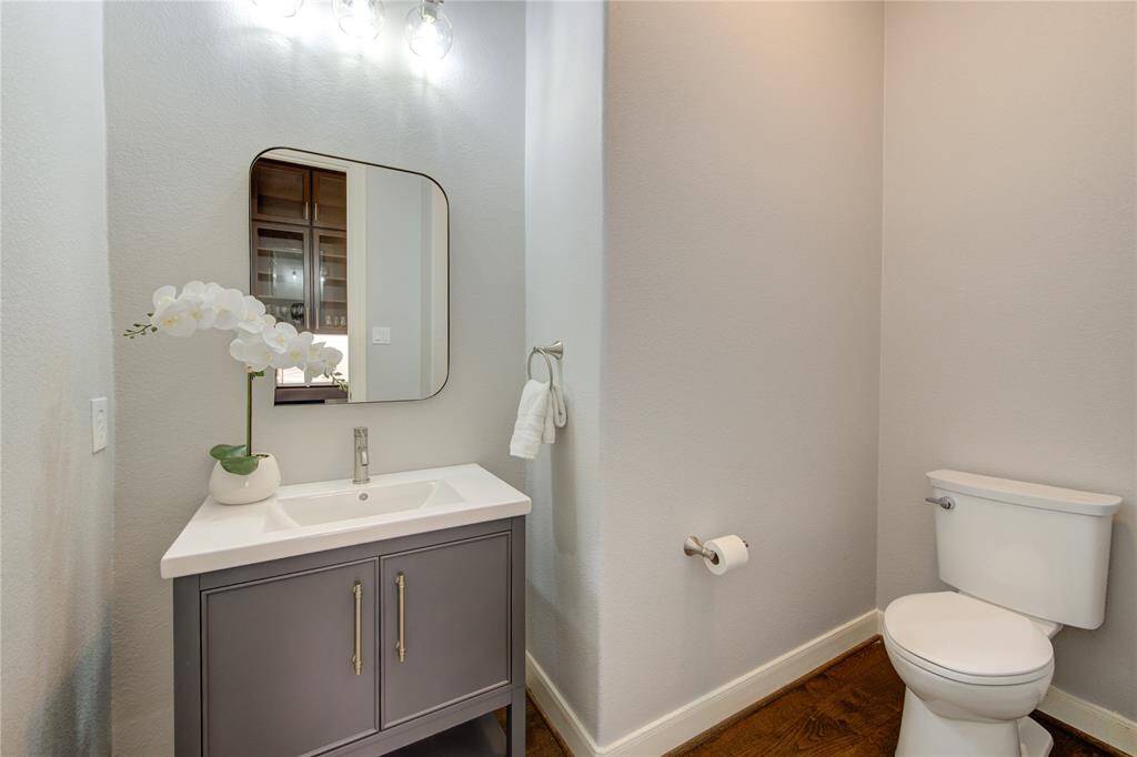 Tastefully designed powder room with elegant fixtures and stylish finishes offering convenience for guests