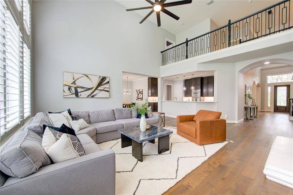 Sightlines to the gourmet kitchen and a stunning upstairs catwalk—blending luxury design with everyday comfort