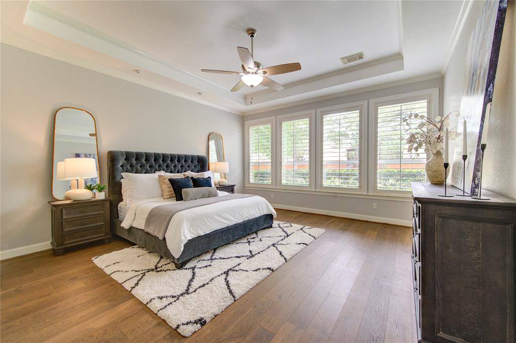 Generous space in the primary suite offers room complete with tranquil backyard views and luxurious privacy