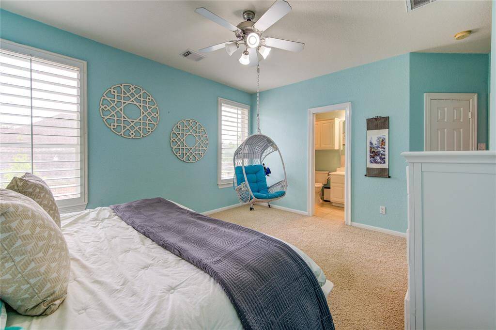 Bright and airy secondary suite with plush carpeting, walk-in closet and direct ensuite access