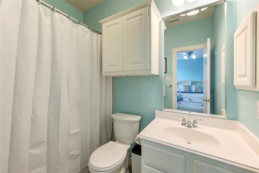 Modern bathroom with clean lines and elegant fixtures—attached to a private bedroom for added convenience