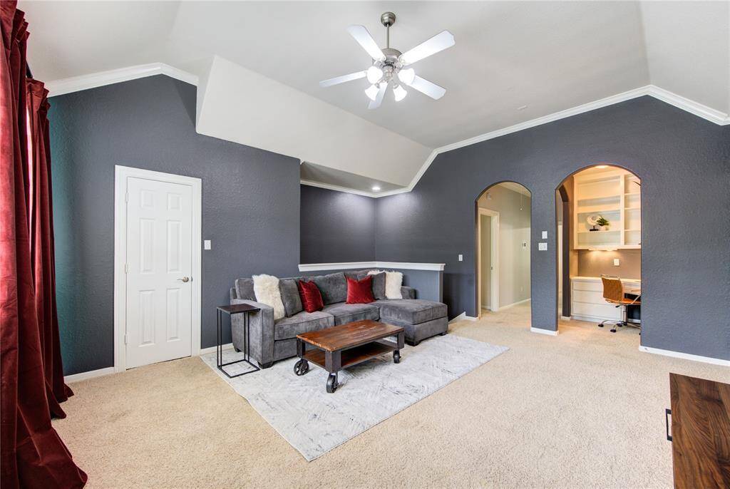 Entertainment-ready space featuring plush carpeting, designed for relaxing or hosting