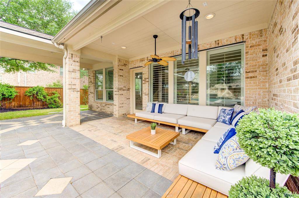 Expansive covered patio with views of the pool—your ideal spot for year-round outdoor living