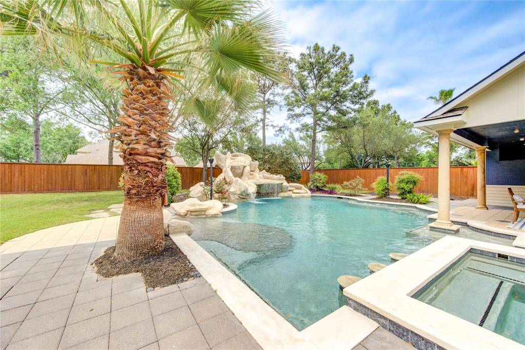 Glistening waters and thoughtfully designed stonework surround this private poolscape inviting you to unwind